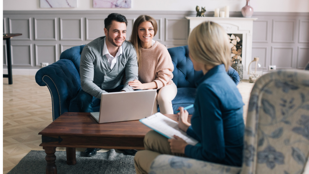 Happy couple talking to a cash home buyer