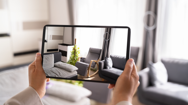 A person taking a photo of the living room using a tablet