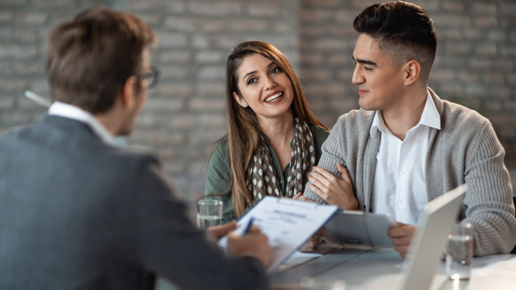 A couple having a discussion with a cash home buyer